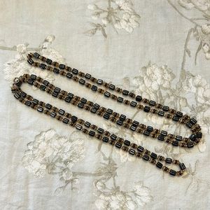 29 inch drop length beaded necklace, can be worn doubled or tripled. EUC